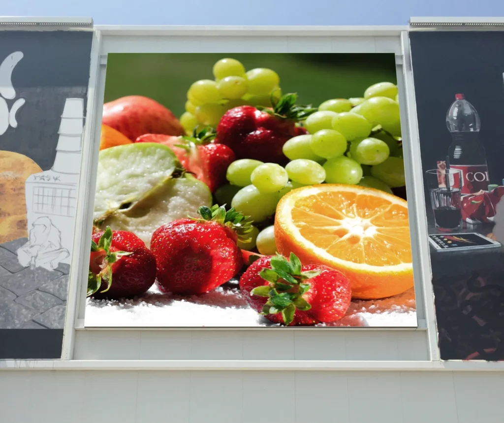 wall mounted outdoor led display screen, the image showed on the screen are fruits