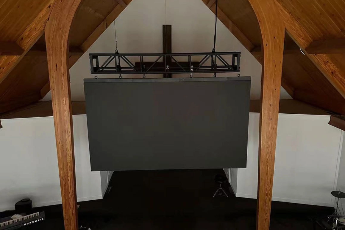 a small video wall hanging in the stage