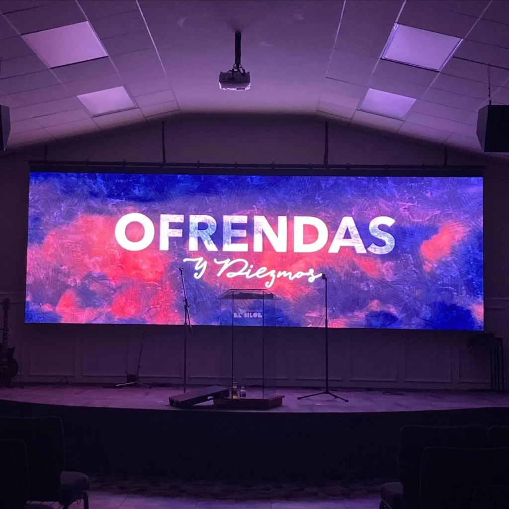 P3.9 LED display screen showing "OFRENDAS," demonstrating high-definition visuals for LED video wall and stage display applications.