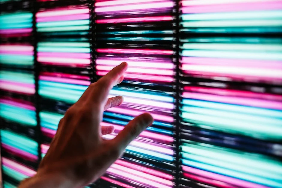 Vibrant LED lights in blue and pink, with a hand reaching out, showcasing modern technology and interaction. - compare smd cob gob and mip on led video wall