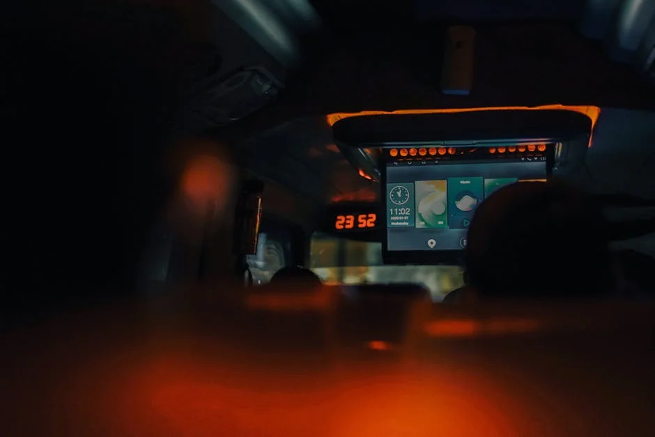 A dimly lit bus interior showcasing screens and ambient lighting during night travel. - 8 by 12 led screen