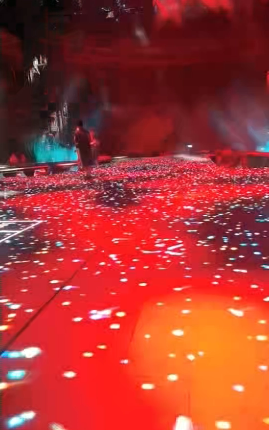 a dance floor set on the wall and show red color image on it