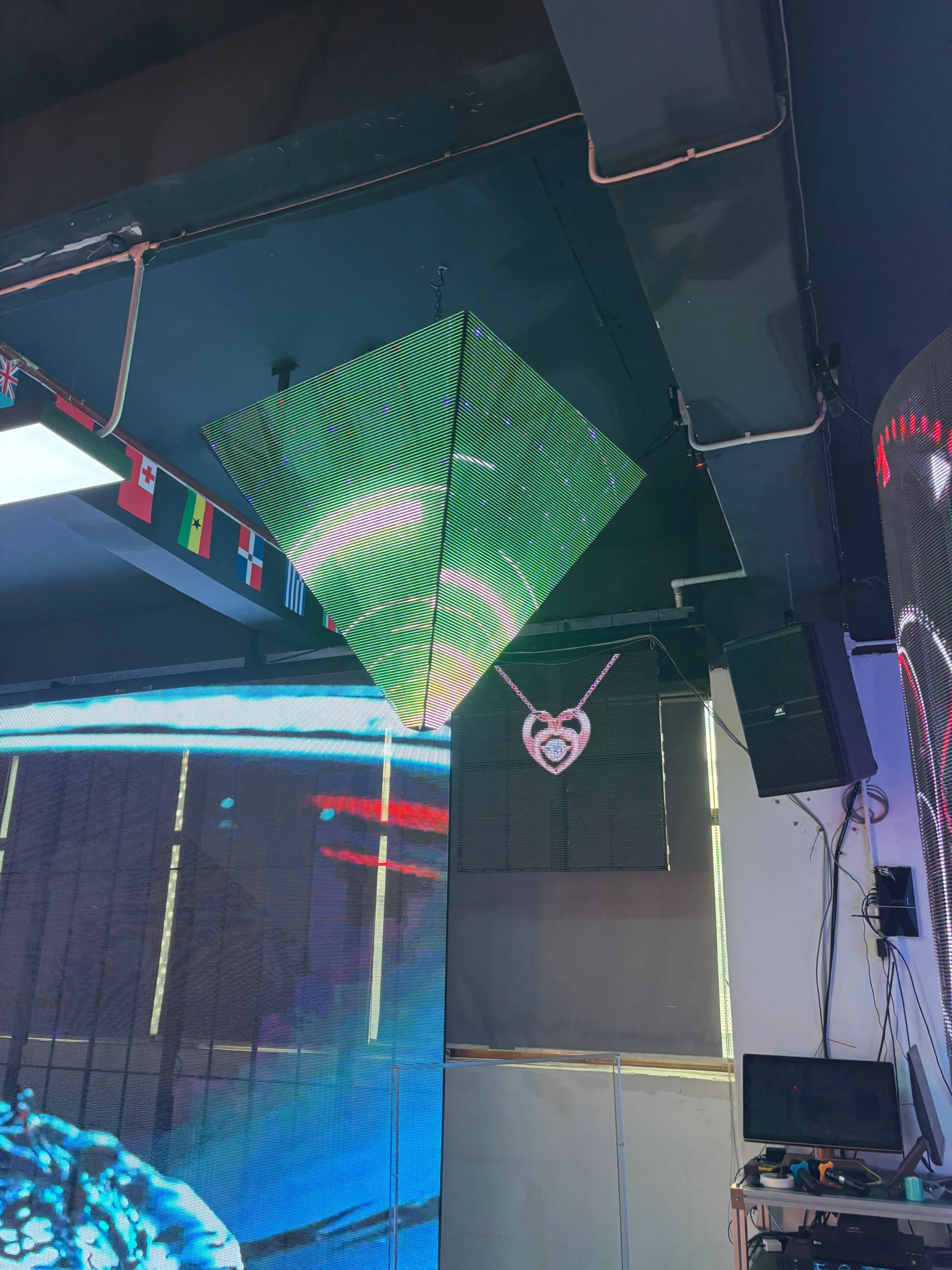 a conical display screen is suspened from the ceiling