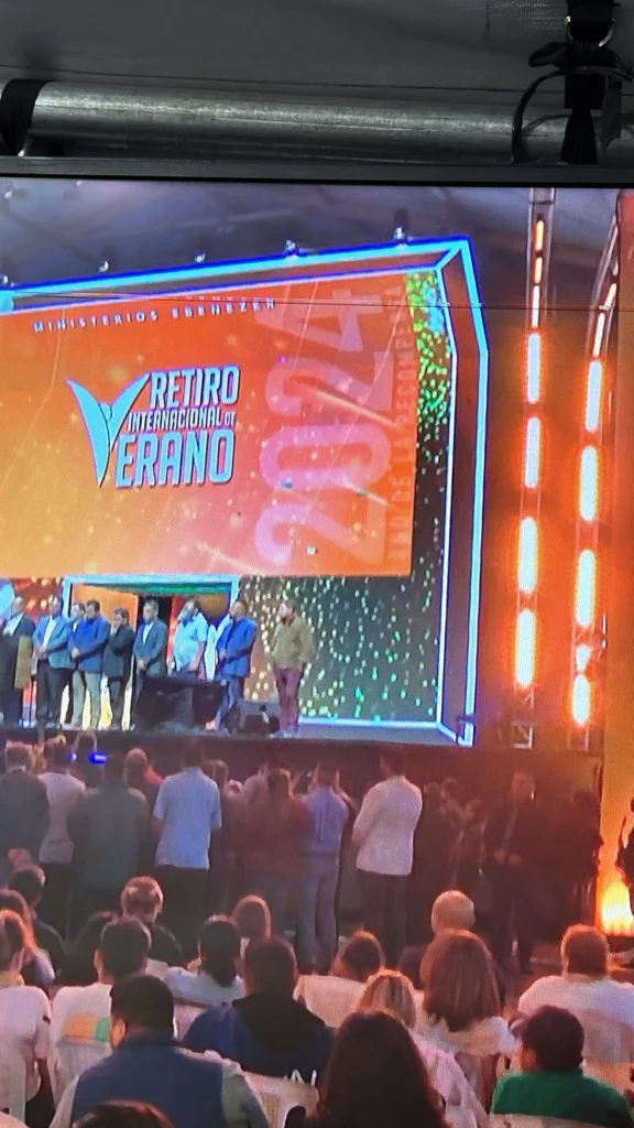a live show, stand with many people adn set with a big led wall
