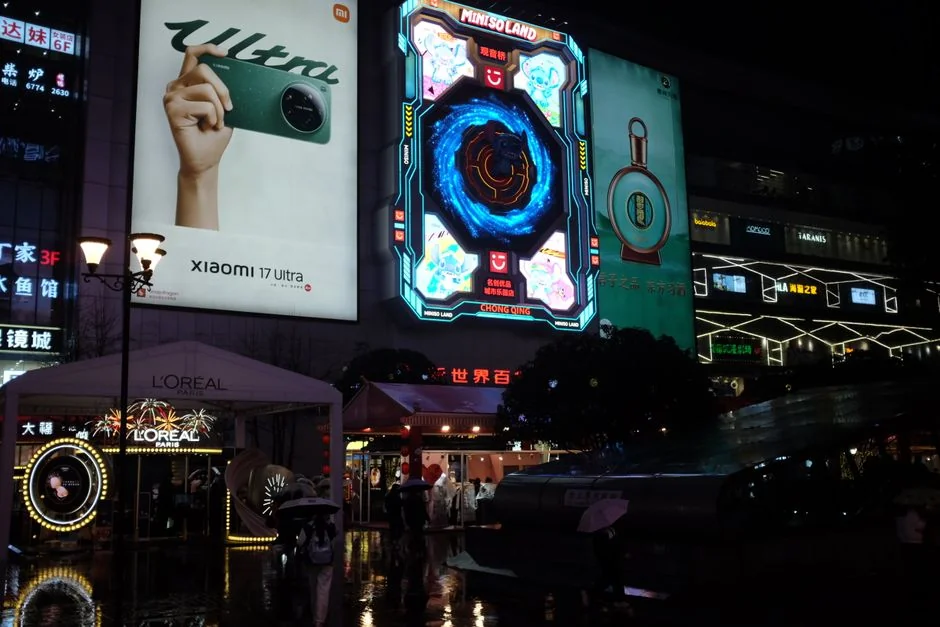 Vibrant urban cityscape at night showcasing illuminated neon billboards and bustling street life. - 3d led billboards in china