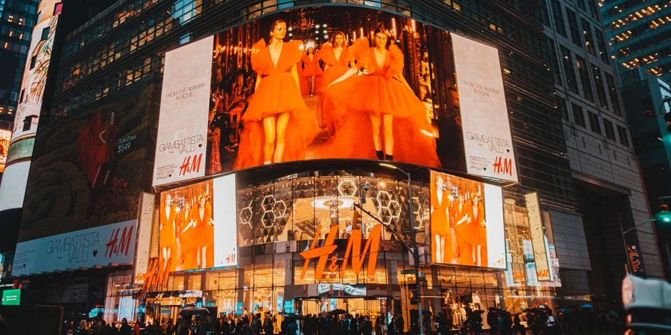 Times Square in NYC illuminated by H&M billboards, capturing urban nightlife and energy. - 3d led billboards in china