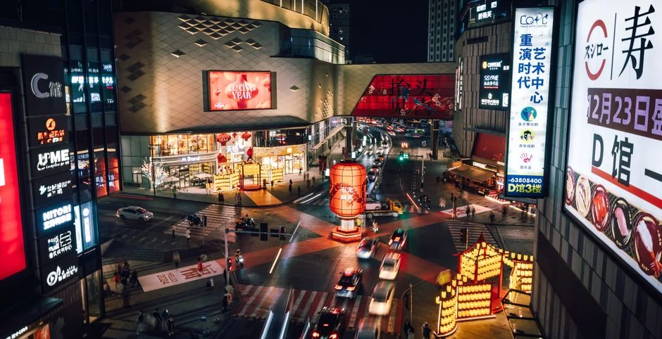 Dynamic city street scene at night with neon lights and traffic in a bustling Asian metropolis. - 3d led billboards in china