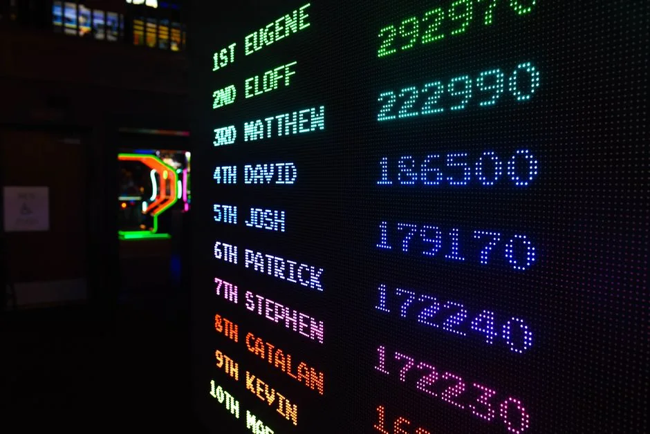 Colorful illuminated arcade scoreboard displaying high scores in a vibrant gaming ambiance. - led color displays